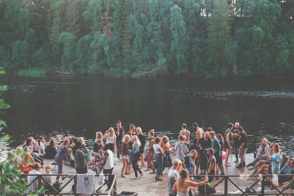 Group of Millennials hanging out at a lake